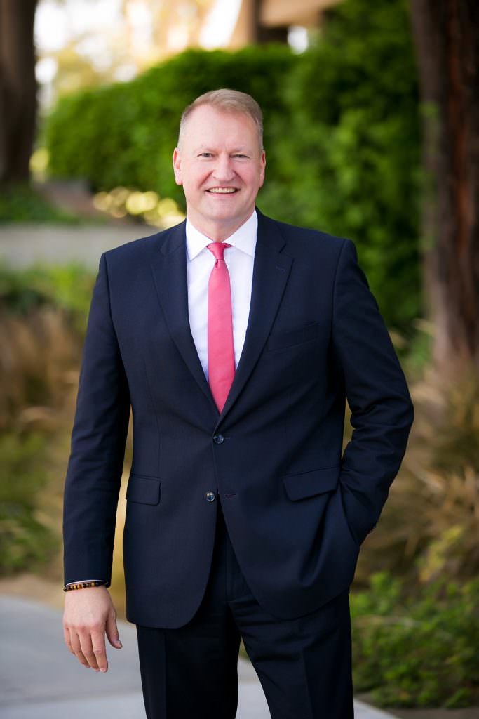 Outdoor professional headshot example of male attorney. .