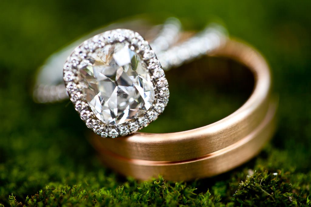 wedding ring close up of diamond ring on grooms wedding band