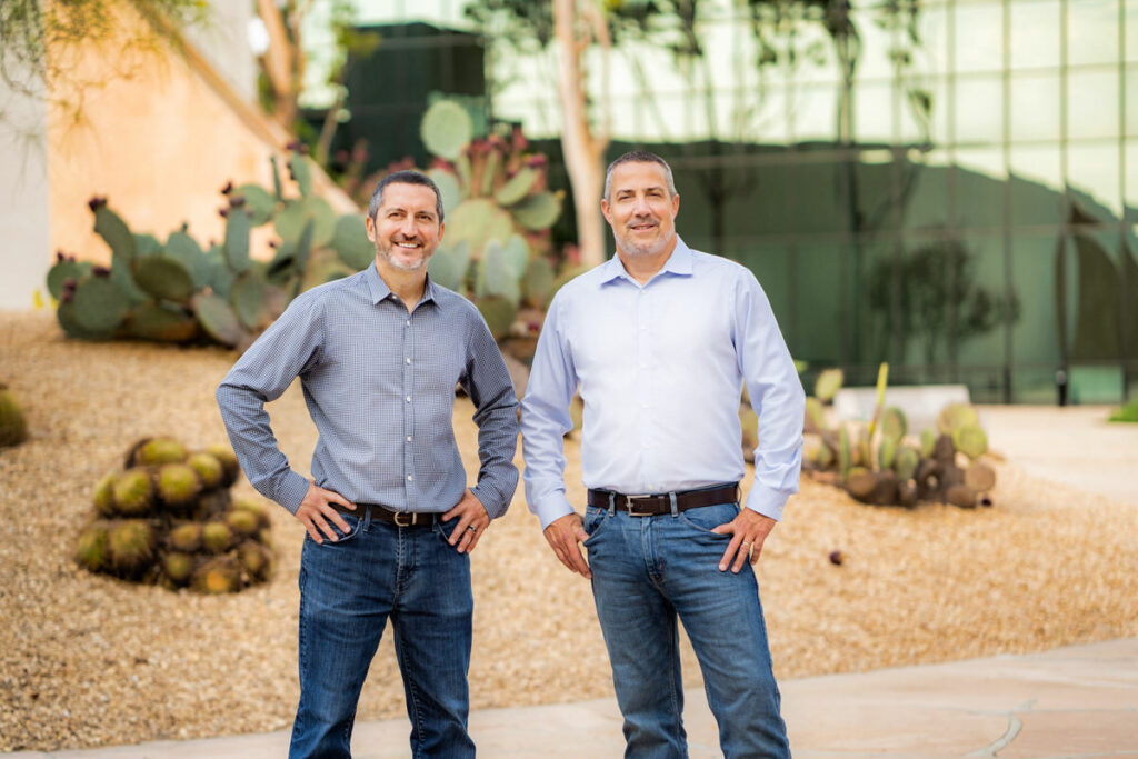 Two business men standing in front of the cactus garden at Noguchi Garden in Costa Mesa