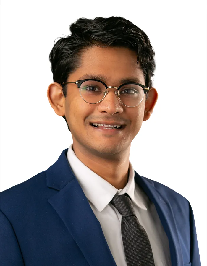 ERAS photo example of headshot of young male wearing blue suit on white background